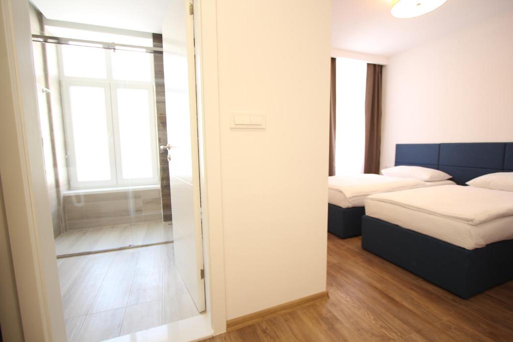 Postel nebo postele na pokoji v ubytování Riverside Residence