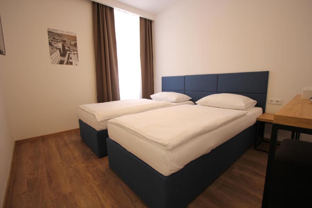 Postel nebo postele na pokoji v ubytování Riverside Residence