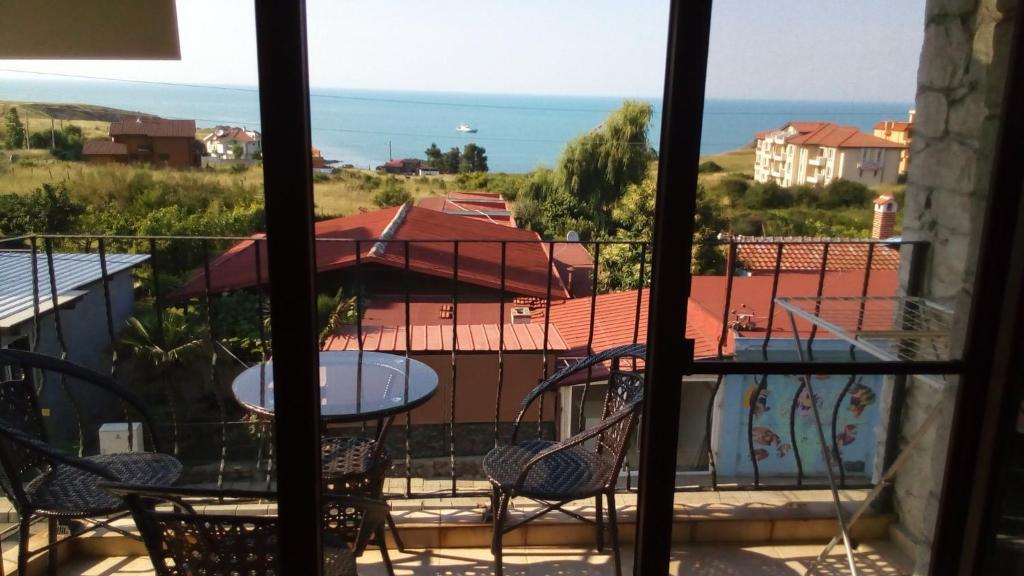 a view of a balcony with a table and chairs at Maisonette Endless Blue in Sinemorets