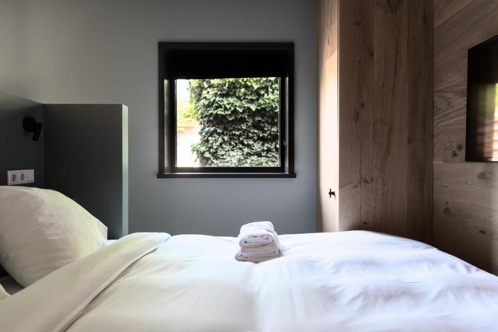Postel nebo postele na pokoji v ubytování Vesting Hotel Naarden
