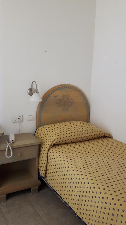 Postel nebo postele na pokoji v ubytování Alghero Vacanze Hotel