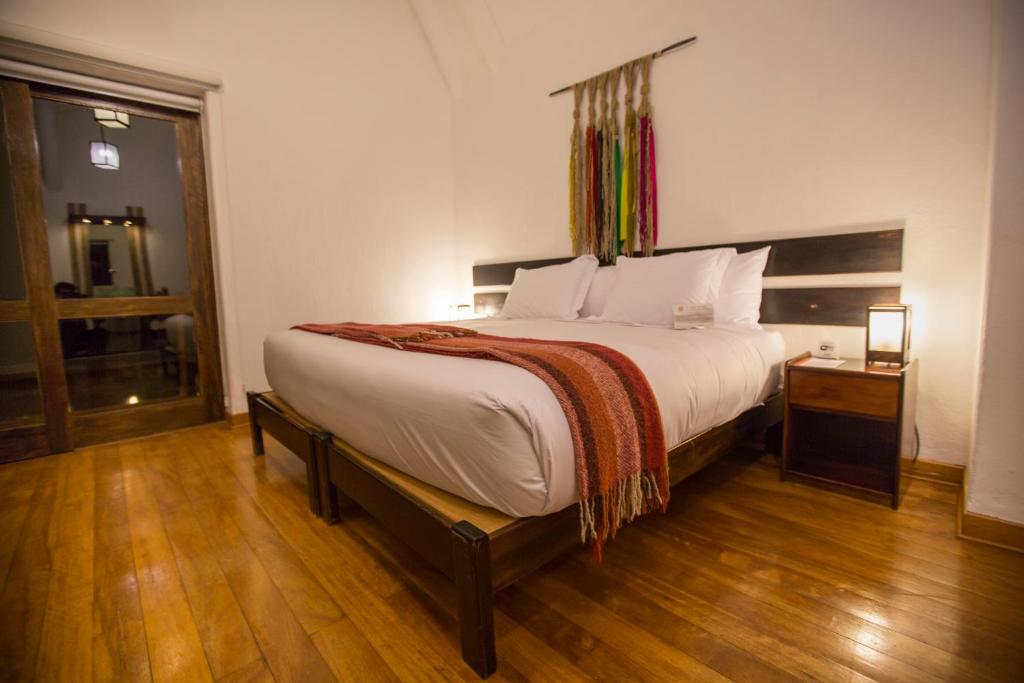 Postel nebo postele na pokoji v ubytování Tierra Viva Valle Sagrado Hotel
