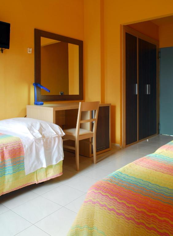 Łóżko lub łóżka w pokoju w obiekcie Hotel Michelangelo