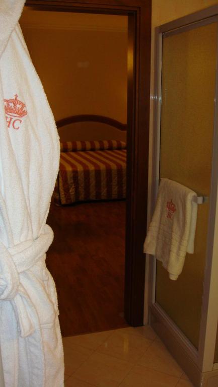 Postel nebo postele na pokoji v ubytování Albergo Corona