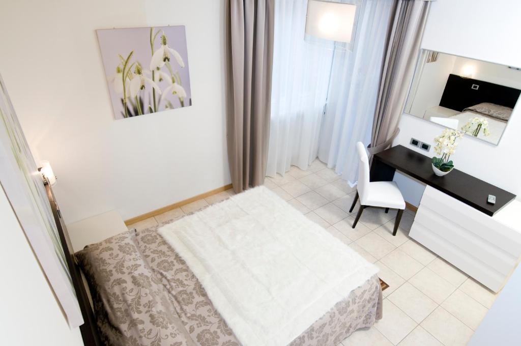 Postel nebo postele na pokoji v ubytování Hotel Alle Due Palme