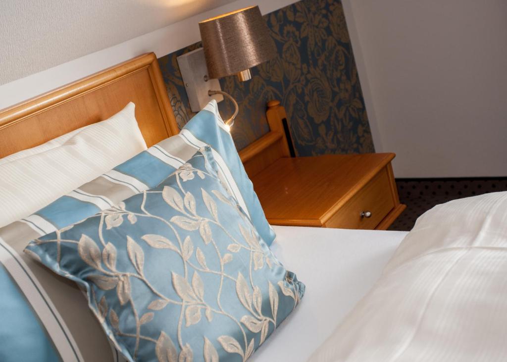 Postel nebo postele na pokoji v ubytování Hotel Rech