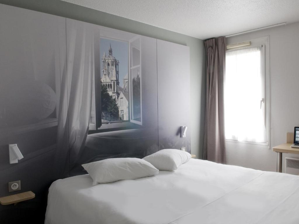 Postel nebo postele na pokoji v ubytování B&B HOTEL Saint-Quentin