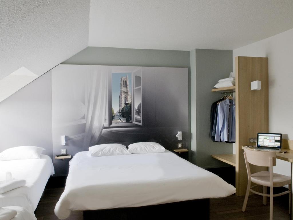 Postel nebo postele na pokoji v ubytování B&B HOTEL Saint-Quentin