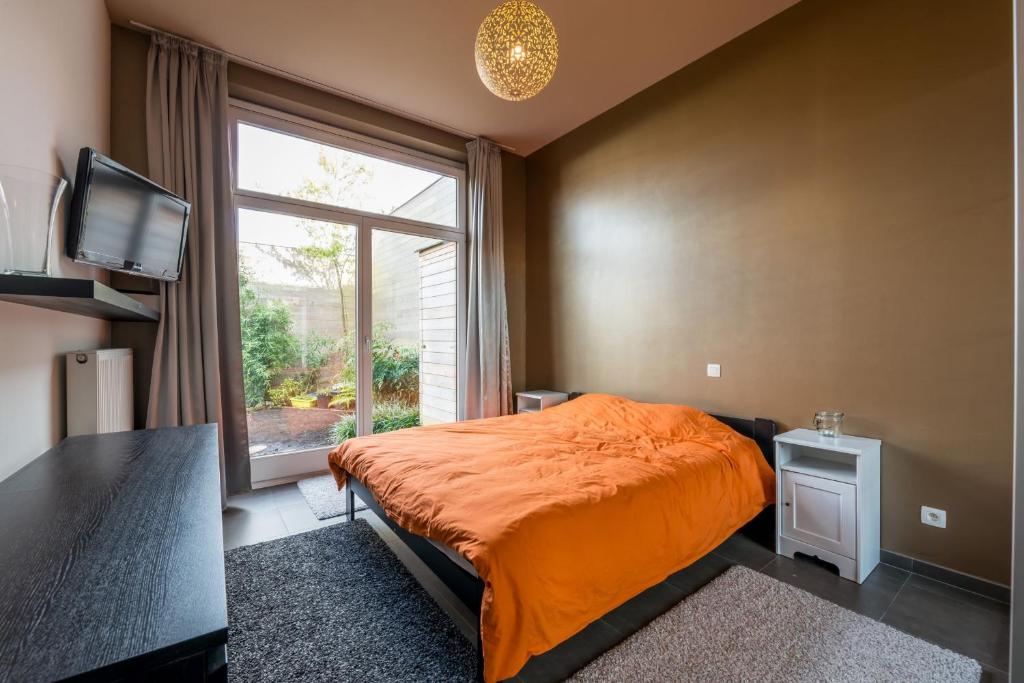Łóżko lub łóżka w pokoju w obiekcie Guesthouse De Roode