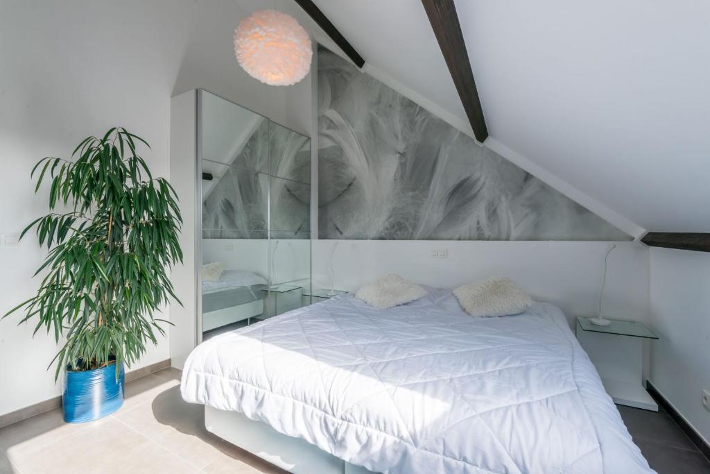 Łóżko lub łóżka w pokoju w obiekcie Guesthouse De Roode