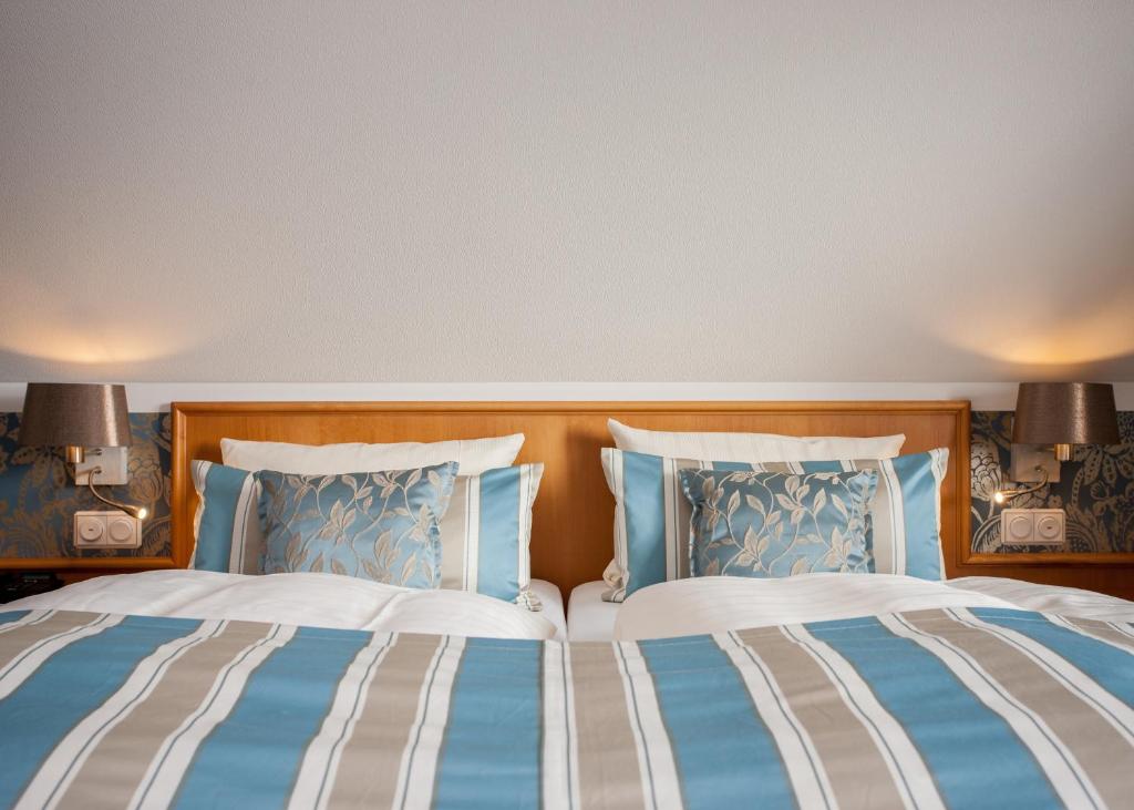 Postel nebo postele na pokoji v ubytování Hotel Rech