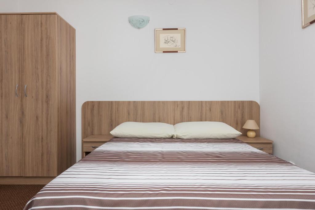 Postel nebo postele na pokoji v ubytování Dom Gościnny Oskar