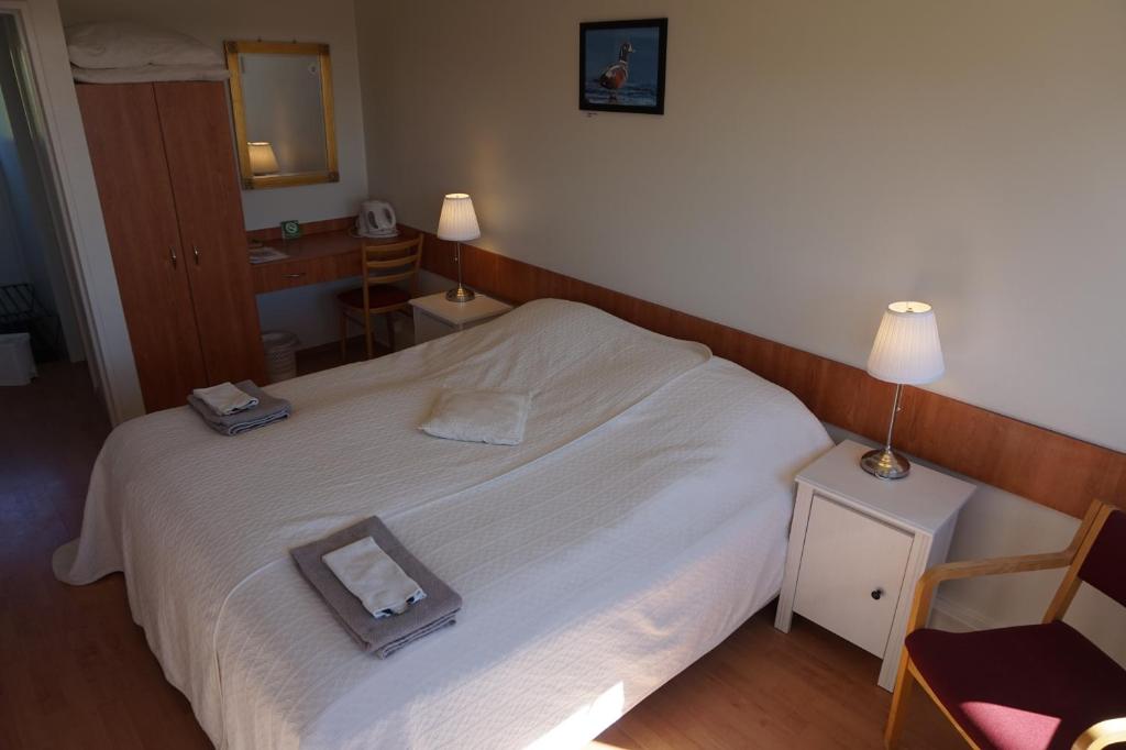 Postel nebo postele na pokoji v ubytování Skútustadir Guesthouse