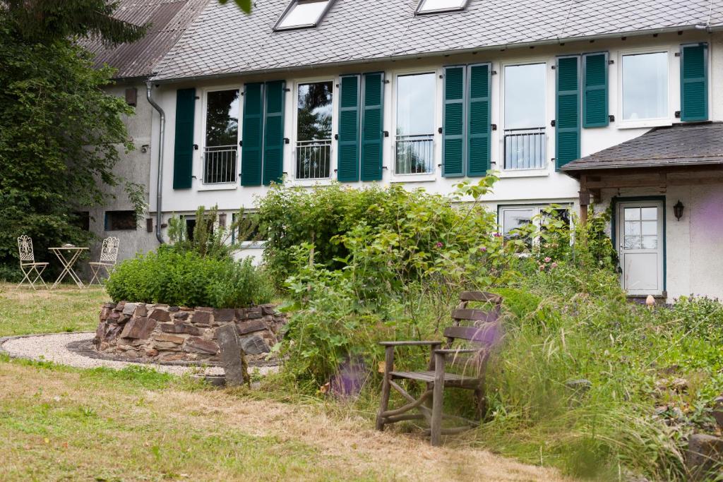 an old chair in the yard of a house at Landhaus 3 Birken in Landkern