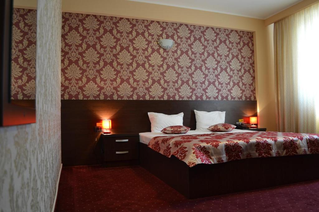 Postel nebo postele na pokoji v ubytování Hotel Athos