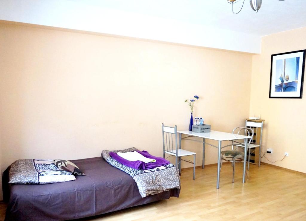 Postel nebo postele na pokoji v ubytování Apartmany Jachymov