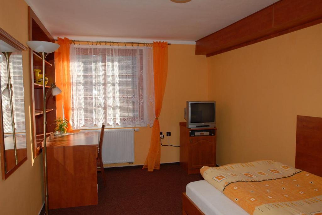 Postel nebo postele na pokoji v ubytování Penzion Charlie
