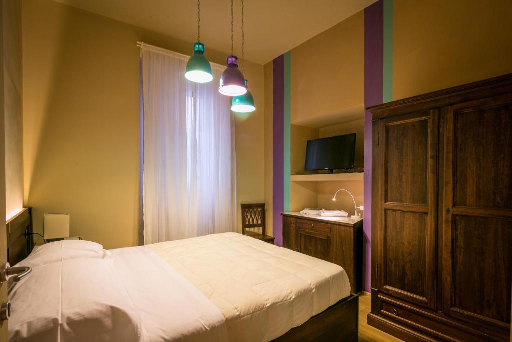 Postel nebo postele na pokoji v ubytování Bed and Breakfast Mameli 67