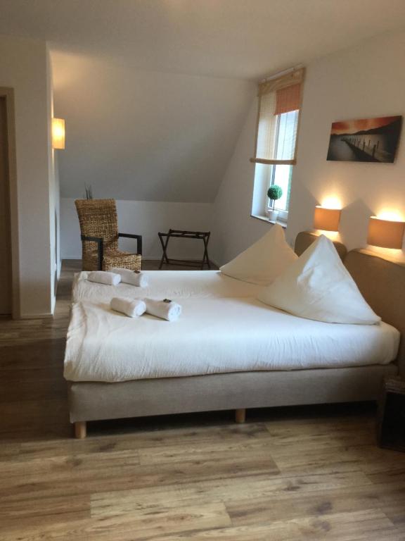 Postel nebo postele na pokoji v ubytování Hotel Zum Alten Schlagbaum