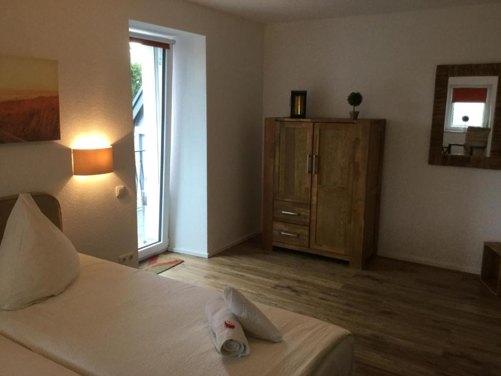 Postel nebo postele na pokoji v ubytování Hotel Zum Alten Schlagbaum