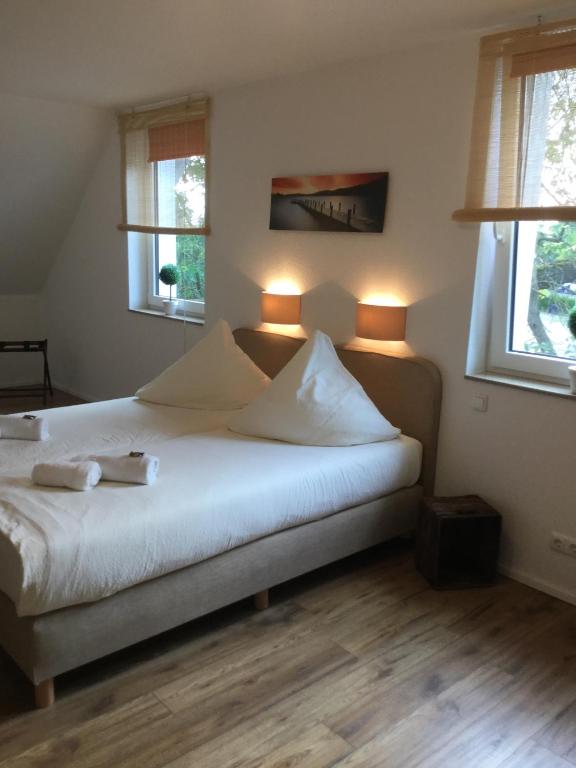 Postel nebo postele na pokoji v ubytování Hotel Zum Alten Schlagbaum