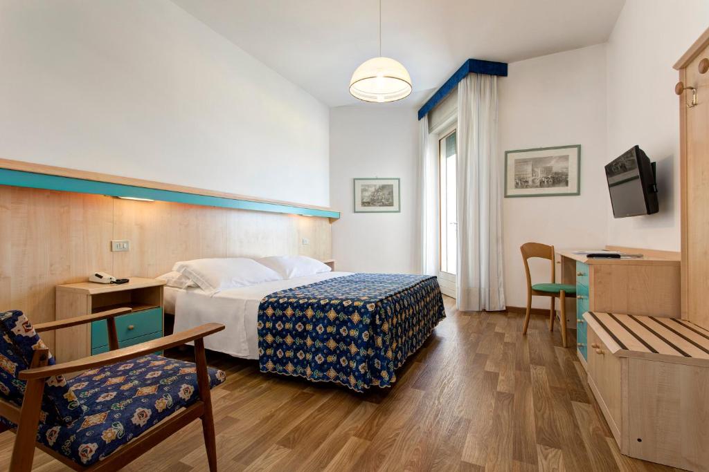 Postel nebo postele na pokoji v ubytování Hotel Las Vegas