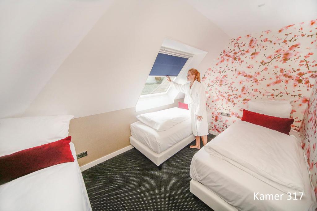 Postel nebo postele na pokoji v ubytování Van der Valk Hotel Assen