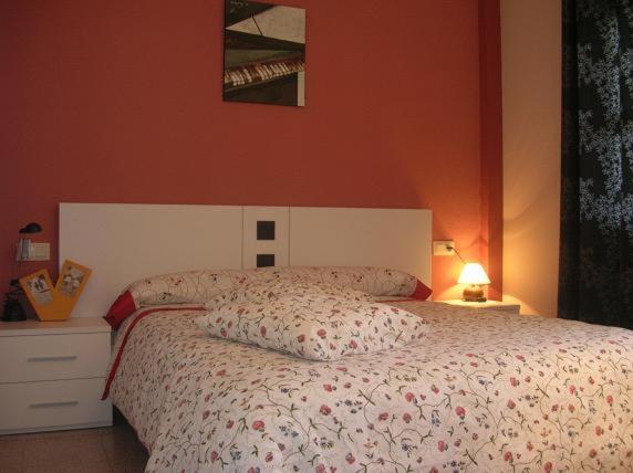 A bed or beds in a room at Ático Louis Braille