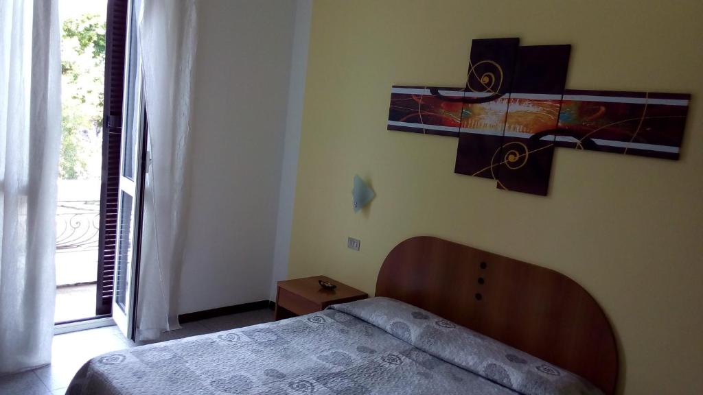 Postel nebo postele na pokoji v ubytování Hotel Tirreno