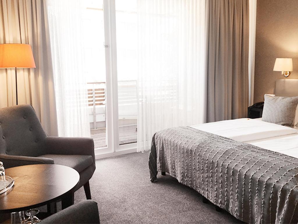 Postel nebo postele na pokoji v ubytování Hotel Ancora