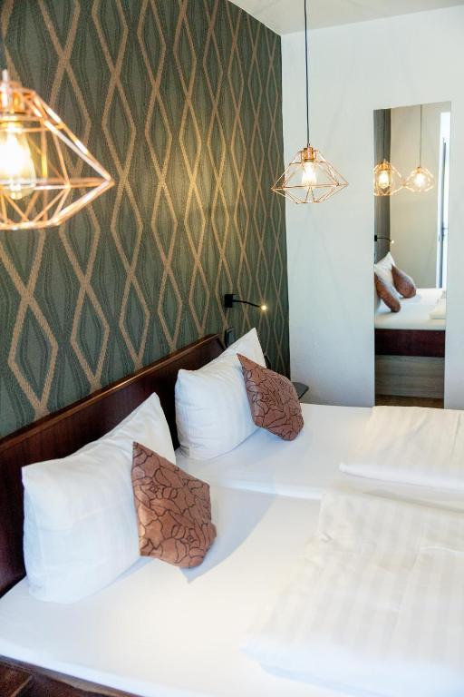 Postel nebo postele na pokoji v ubytování Hotel Stümpelstal