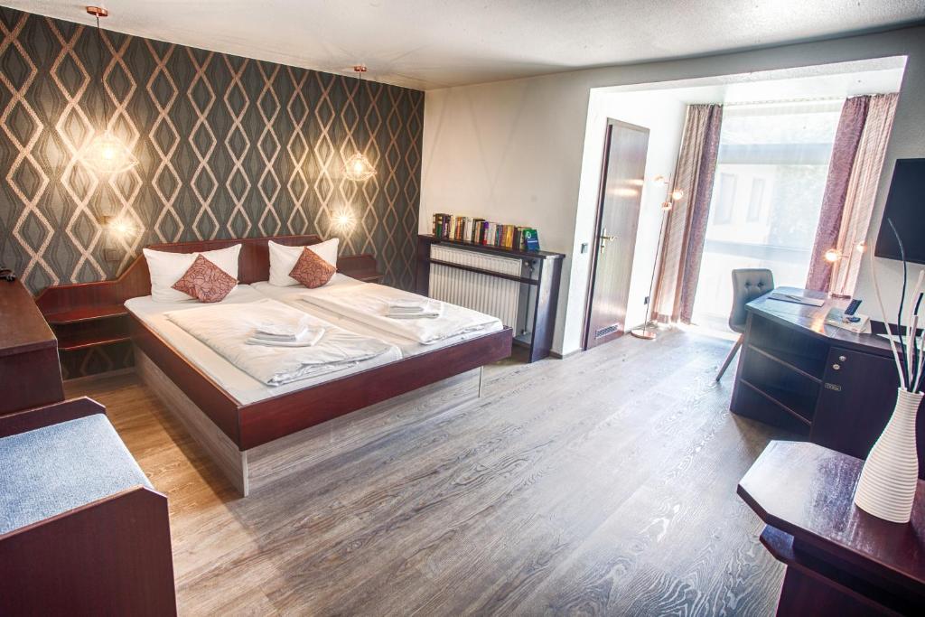 Postel nebo postele na pokoji v ubytování Hotel Stümpelstal