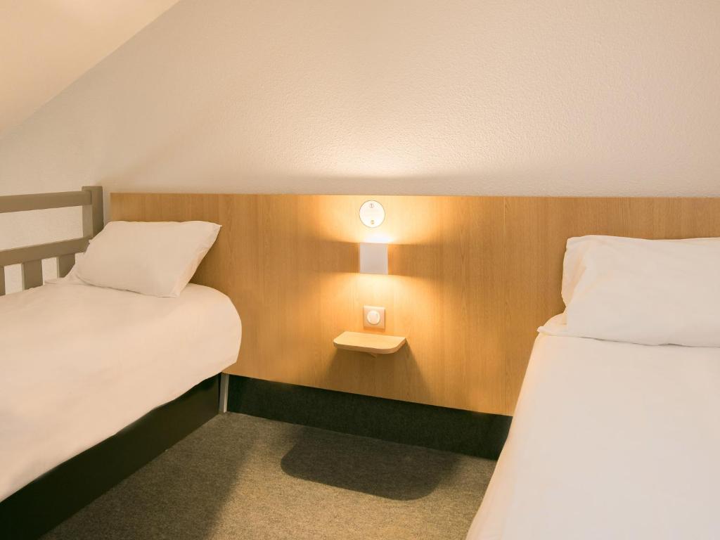 Postel nebo postele na pokoji v ubytování B&B HOTEL Cherbourg
