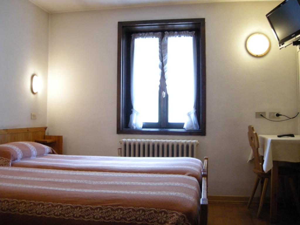 Postel nebo postele na pokoji v ubytování Hotel Federia
