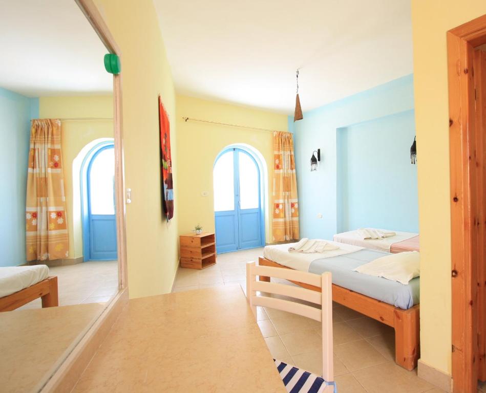 Postel nebo postele na pokoji v ubytování El Primo Hotel Dahab