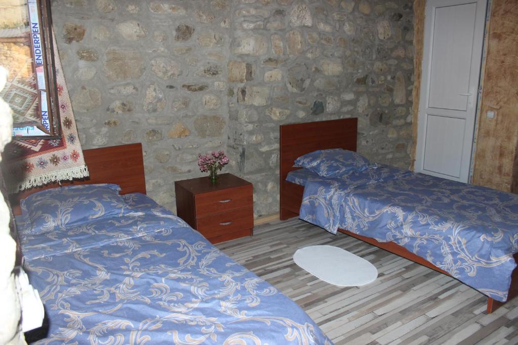 Postel nebo postele na pokoji v ubytování Golden Cradle