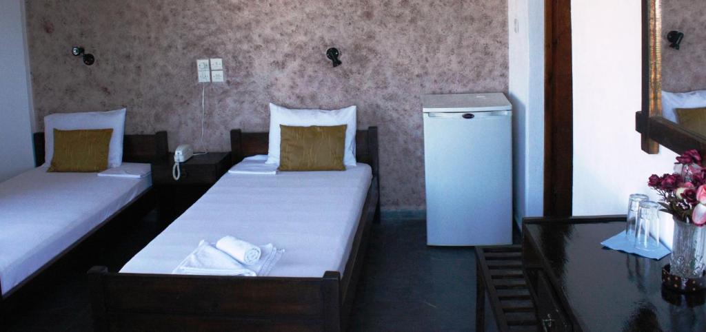 Postel nebo postele na pokoji v ubytování Elvira Hotel