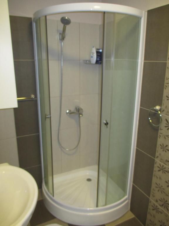 A bathroom at Genex Apartment