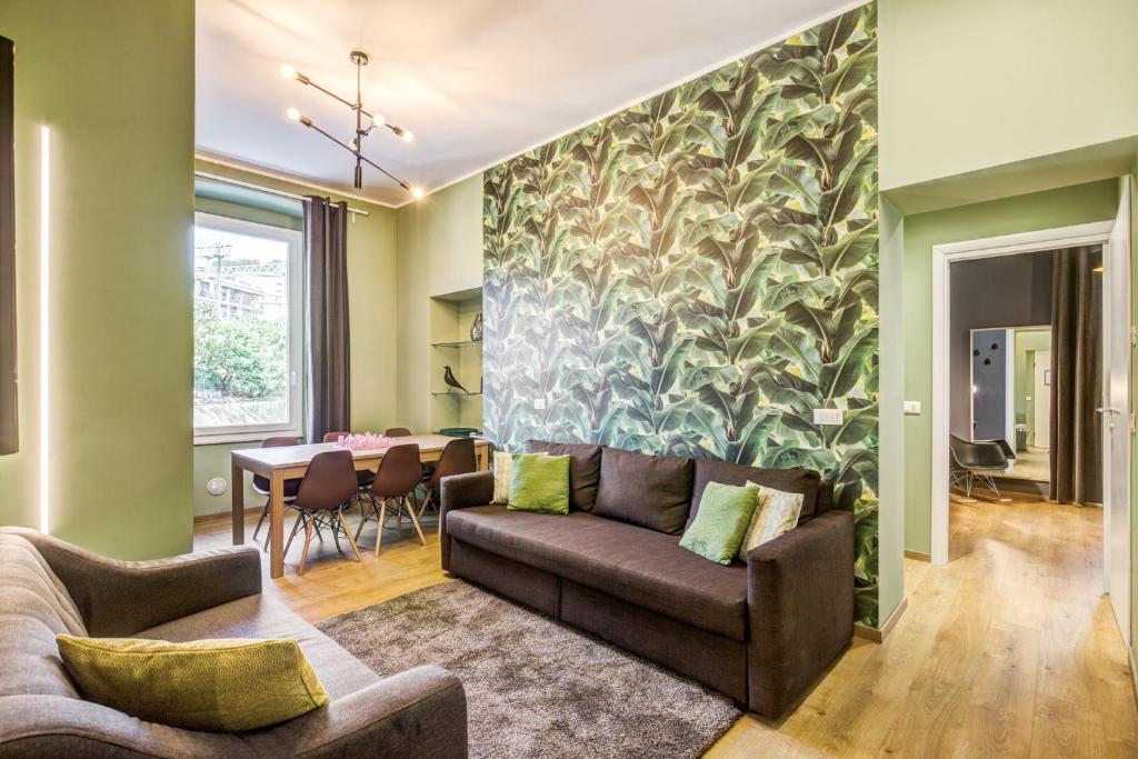 a living room with a couch and a table at Cinque Terre Stylish Apartments in La Spezia