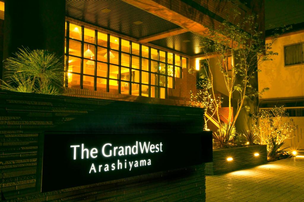 a sign that reads the grand westassmitharma at night at The GrandWest Arashiyama in Kyoto