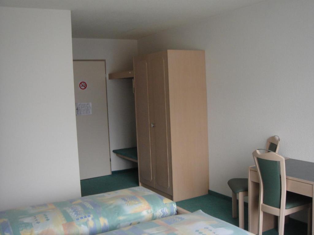 Postel nebo postele na pokoji v ubytování Hotel Eden Sisikon