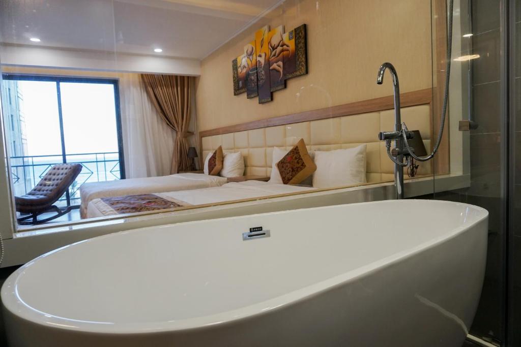 Postelja oz. postelje v sobi nastanitve Ruby Hotel