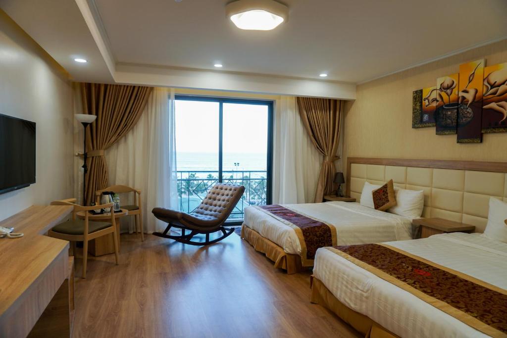 Postelja oz. postelje v sobi nastanitve Ruby Hotel
