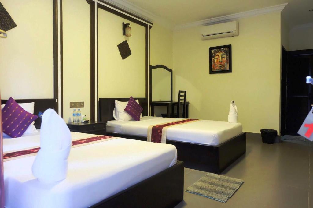 Postel nebo postele na pokoji v ubytování VIBOLA Guesthouse
