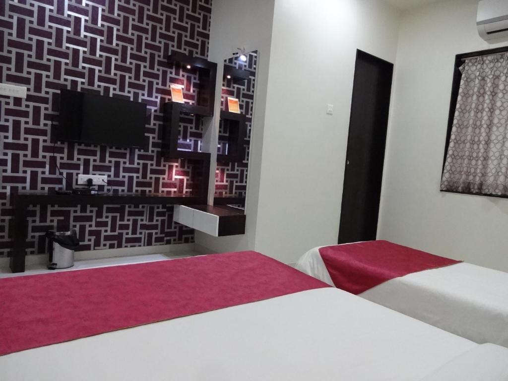 Postel nebo postele na pokoji v ubytování Teerth Villa