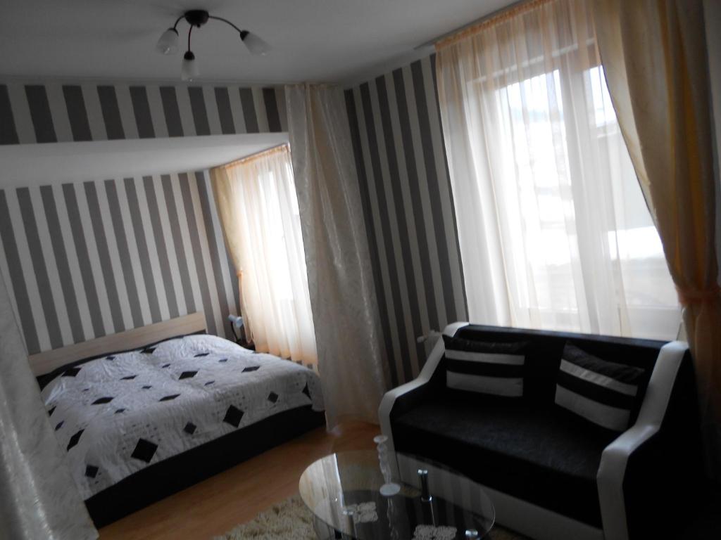 Postel nebo postele na pokoji v ubytování Guest House Tsenovi