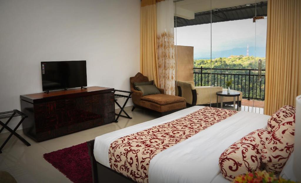 Postel nebo postele na pokoji v ubytování Romance Hills Hotel