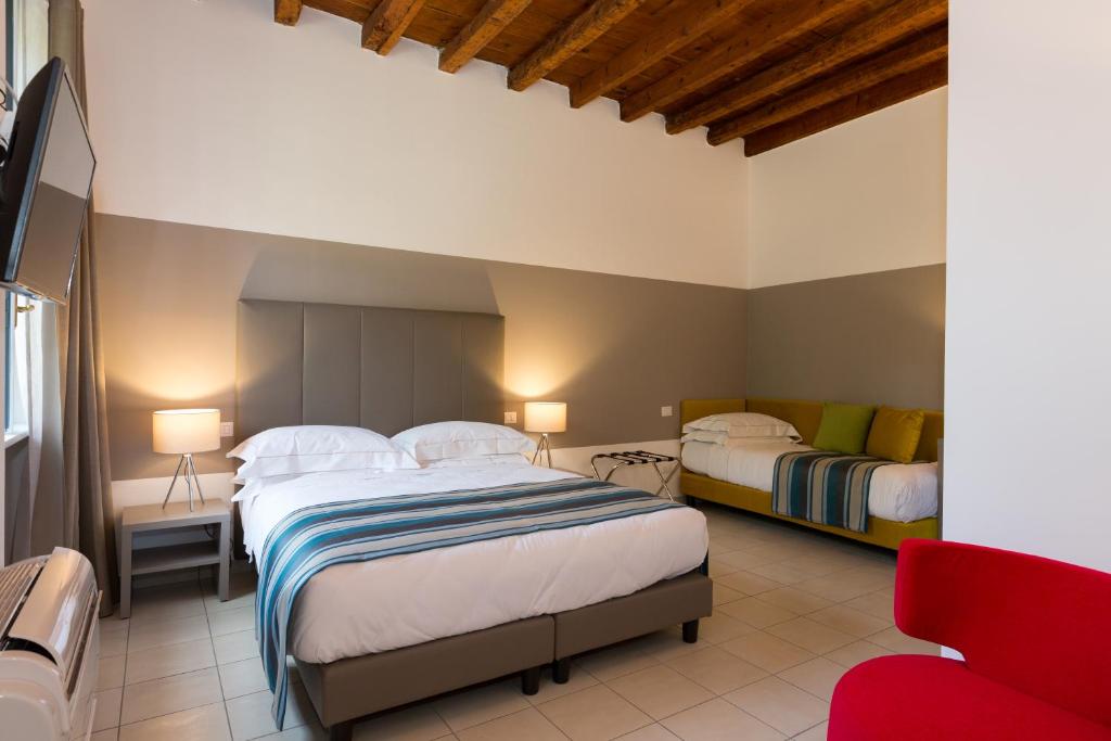 Postel nebo postele na pokoji v ubytování Ai Suma Hotel