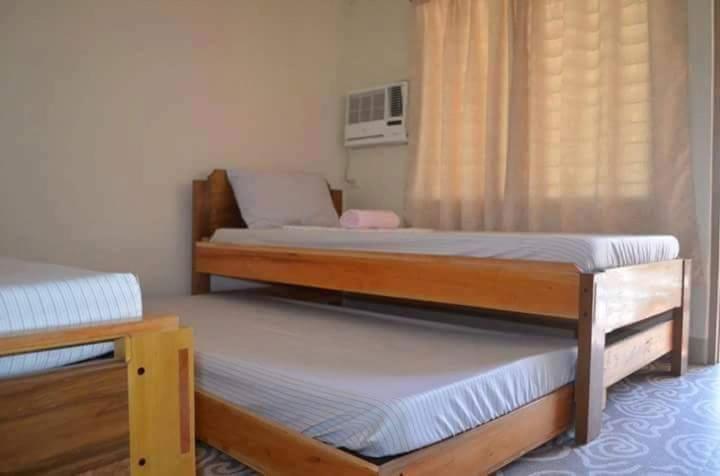 Postel nebo postele na pokoji v ubytování Krizma Inn