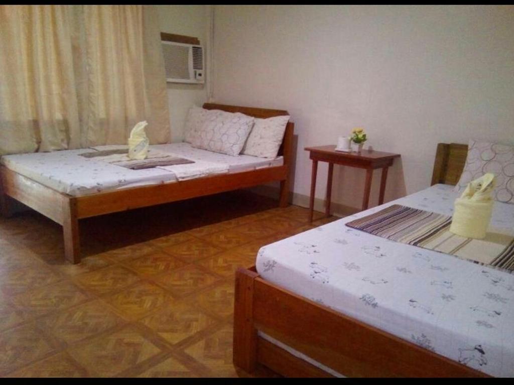 Postel nebo postele na pokoji v ubytování Krizma Inn